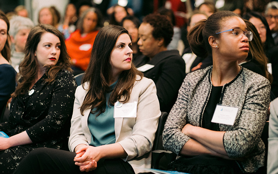 women listening to a conference