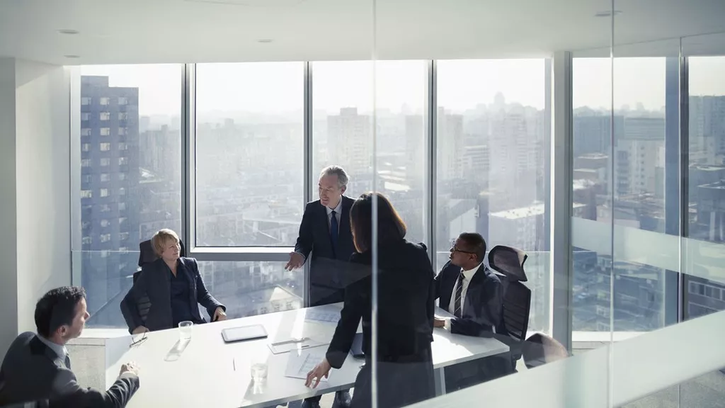 Equileap_LesEchos_GER2025DM. People in a meeting in glass conference room.